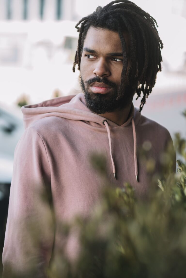 charming-man-looking-away-medium-shot-min-scaled